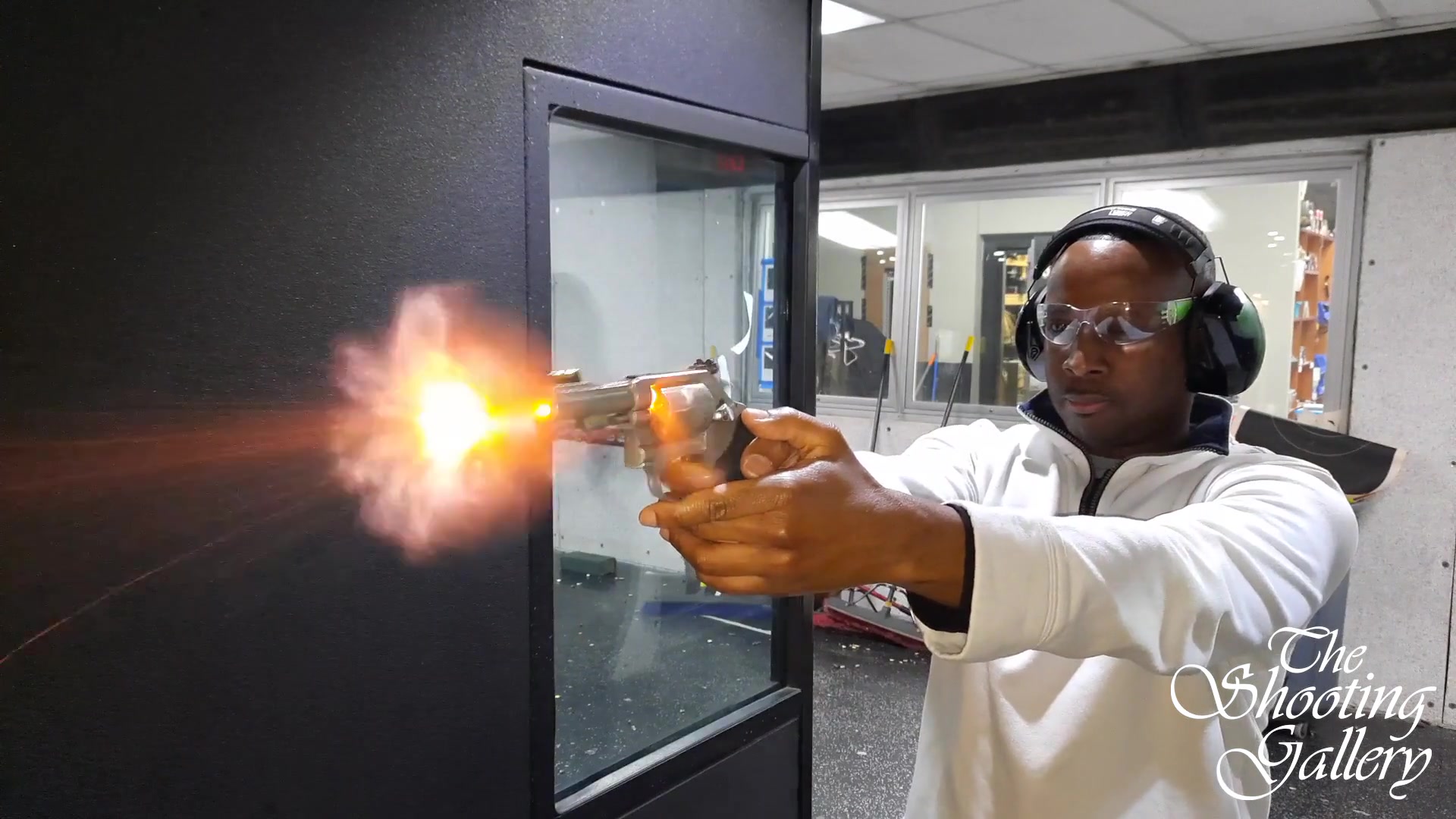 Shooter captured from downrange at the moment of the muzzle blast