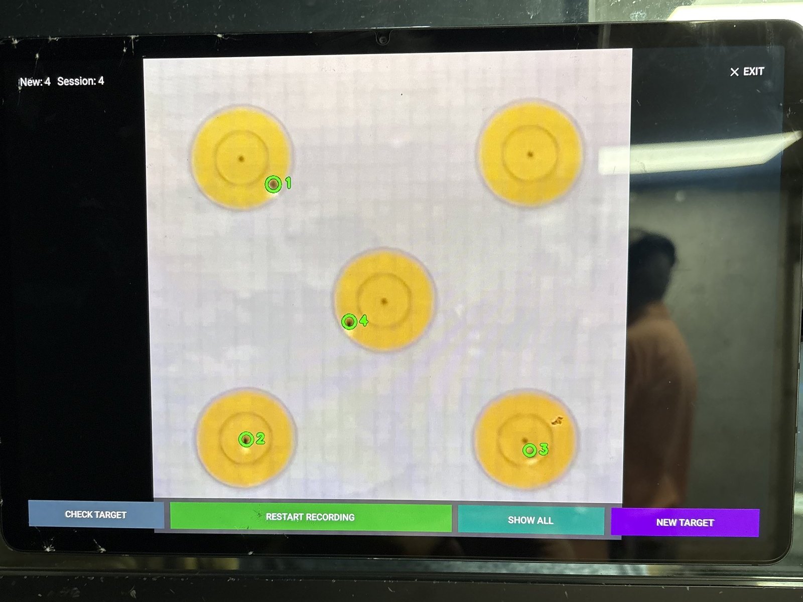 Checked target marking a fresh string, four holes circled and numbered